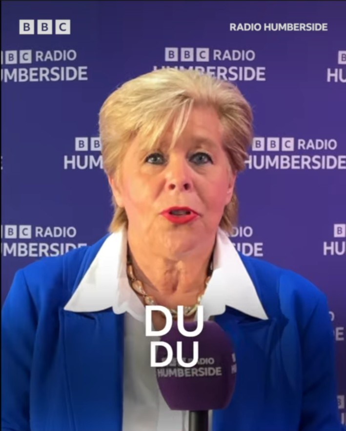 A different mayoral candidate in blue answering a quick-fire question