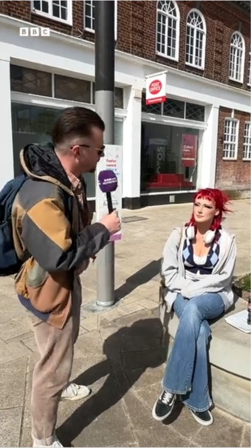 BBC reporter talking to a young shopper on Grimsby high street